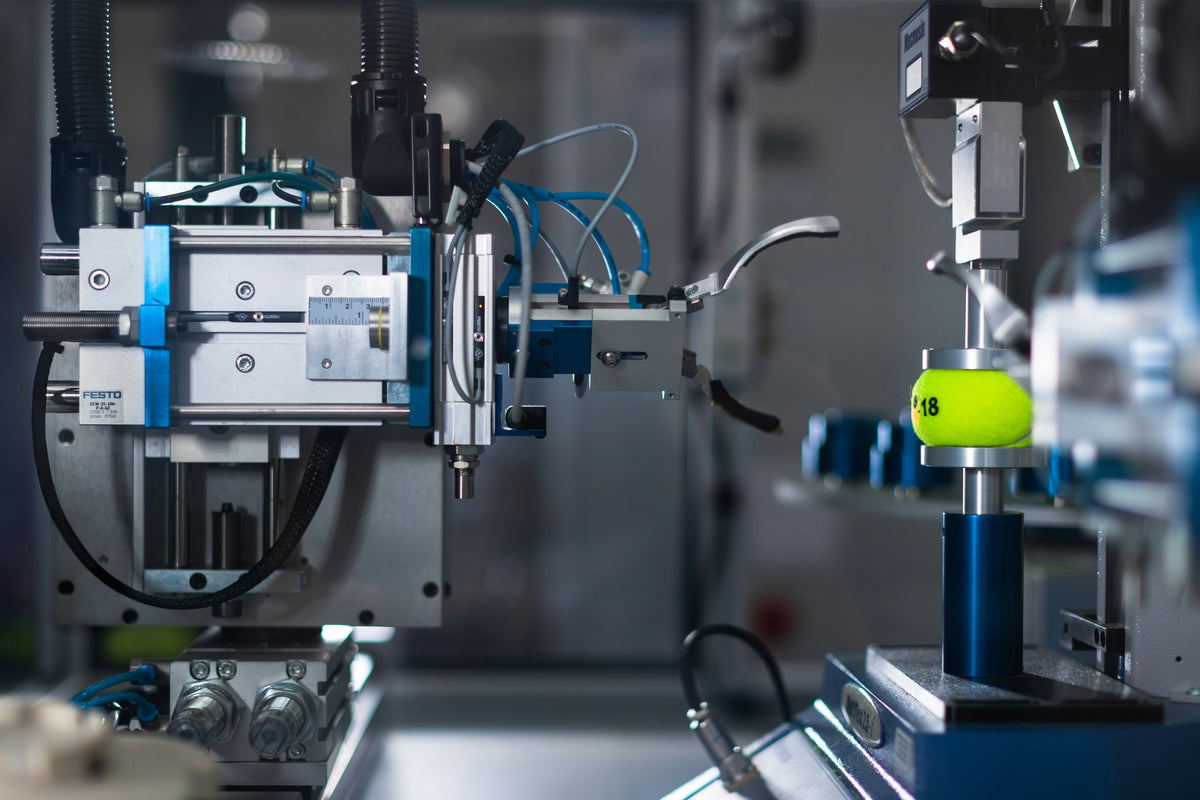 Robotic arm grabbing a tennis ball with machine vision.